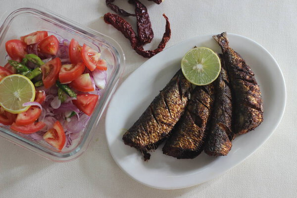 Sardines fry is a traditional Kerala fish dish served for lunch. It is prepared in an air fryer so that no oil is used in frying