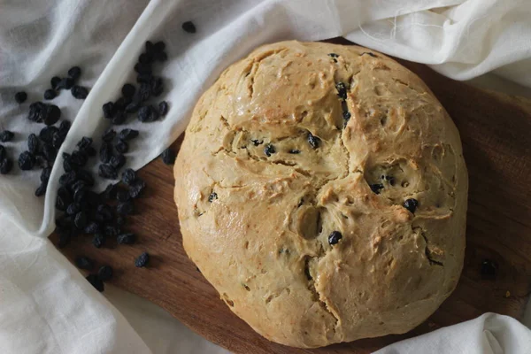 Home baked Irish soda bread with raisins. A quick bread to make at home with out yeast. Shot on white background.
