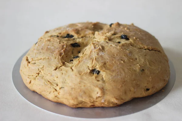 Home baked Irish soda bread with raisins. A quick bread to make at home with out yeast. Shot on white background.