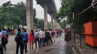 Mumbai, India, June 09 2021: People queuing up for local bus in the evening. People have come of their home for work after a long time as the Covid 19 lockdown restrictions are eased out in Mumbai.