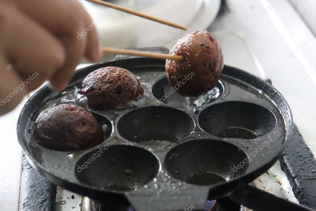 Making of unni appam using unni appam pan. Unni appam or Rice fritters is a traditional snack from the state of Kerala. made with a batter of rice flour, banana, jaggery and roasted coconut pieces. Made in coconut oil.