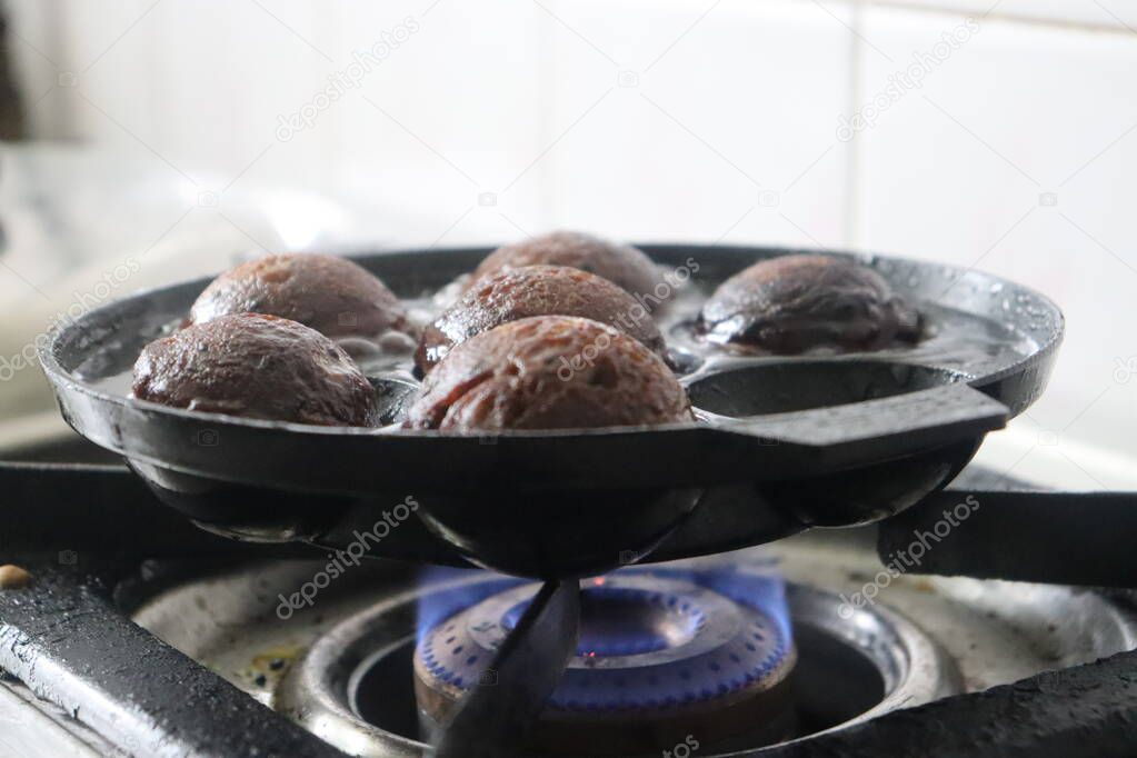 Making of unni appam using unni appam pan. Unni appam or Rice fritters is a traditional snack from the state of Kerala. Made with a batter of rice flour, banana, jaggery and roasted coconut pieces.