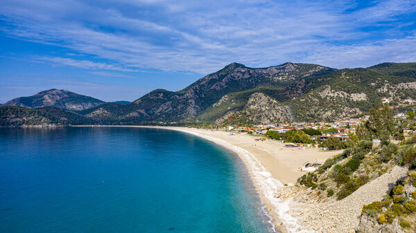 Panoramic shot of Oludeniz, also known as Blue Lagoon, in Fethiye. It is located on south-west of Turkey and it has been a tourist attraction with its blue sea, weather and coast.