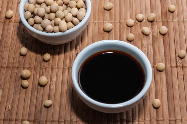 Soy sauce on a tablecloth — Stock Photo, Image
