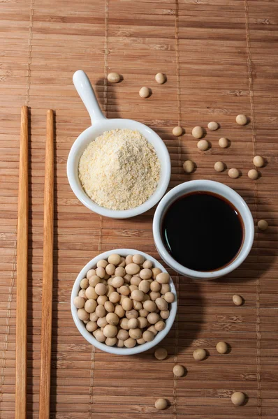 Soy sauce on a tablecloth — Stock Photo, Image