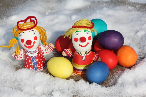 Color Easter eggs with a toy figure of the little man — Stock Photo, Image