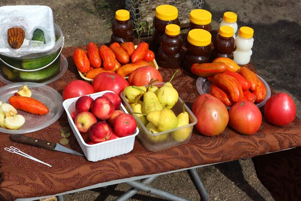 Street trade in the market of vegetables, fruits and honey in summer, Altai Territory, Russia