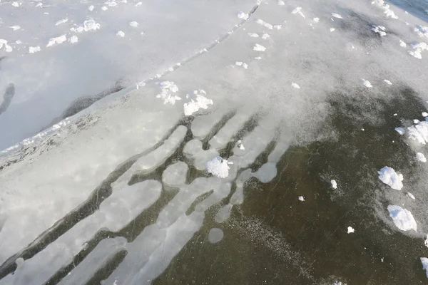 Bubbles under ice, formation of ice on the river — Stock Photo, Image