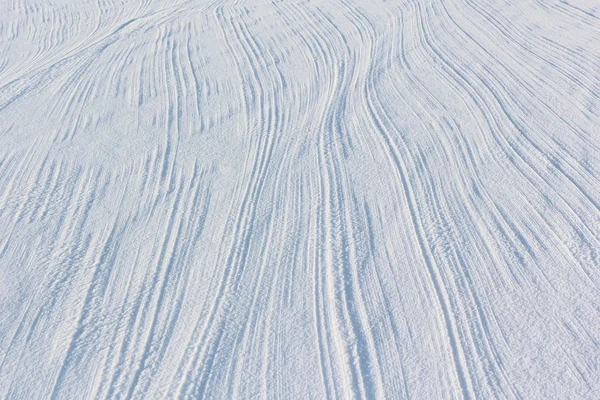 Traces from a parachute cord on snow frozen river — Stock Photo, Image