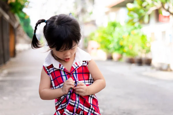 Selective Focus Cute Asian Girl Tries Button Her Red Checkered — Stock Photo, Image