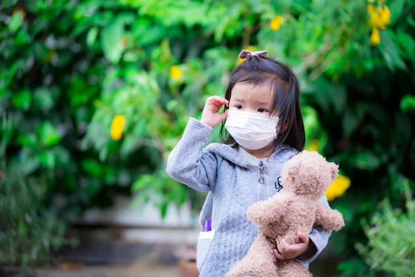 Cute Girl Wearing White Medical Face Mask Holding Brown Teddy — Stock Photo, Image