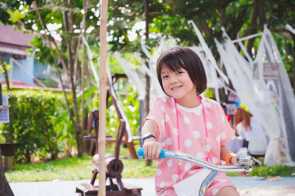 Cute Asian Girl Riding Bicycle Sweet Smile Child Looking Camera — Stock Photo, Image