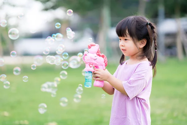 Happy Asian Cute Girl Playing Pink Soap Bubble Gun Child — Stock Photo, Image