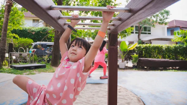 Asian Kid Hanging Bar Playground Sporty Girl Healthy Playing Cute — Fotografia de Stock