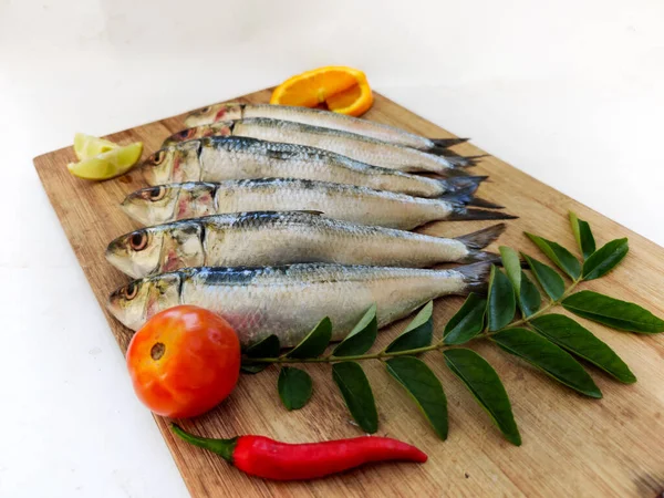 Close View Fresh Indian Oil Sardine Wooden Pad Decorated Herbs — Stock Photo, Image