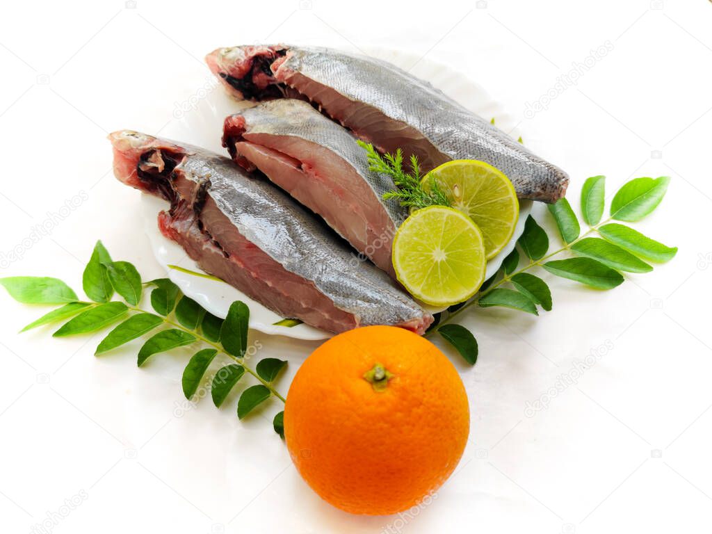 Fresh Ready to cook Black pomfret fish isolated on white background.Selective focus.