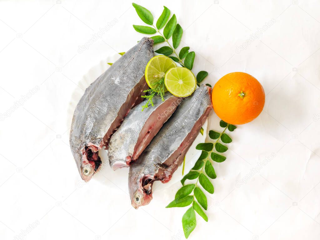 Fresh Ready to cook Black pomfret fish isolated on white background.Selective focus.