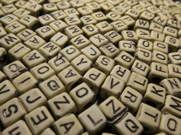 Letters of the English alphabet on a dark background — Stock Photo, Image