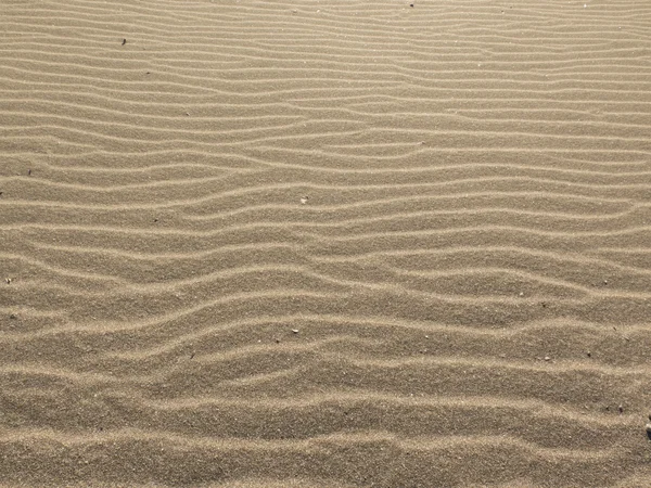 Horizontal background made of sand stacked waves — Stock Photo, Image