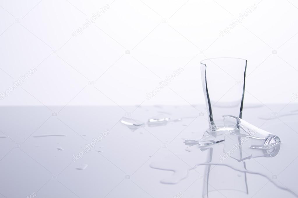 Broken glass on white table