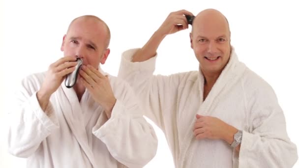 Two men in bathrobes shaving — Stock Video