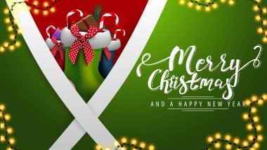 Merry Christmas and happy New Year, green postcard with diagonal white lines and Christmas stockings behind vector Merry Christmas and happy New Year, green postcard with diagonal white lines and Christmas stockings behind vector