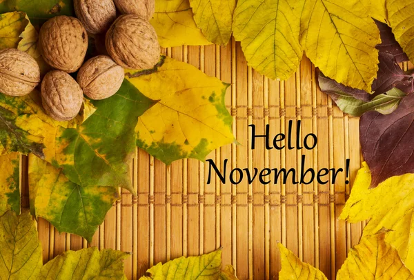 Words hello november on rustic background — Stock Photo, Image