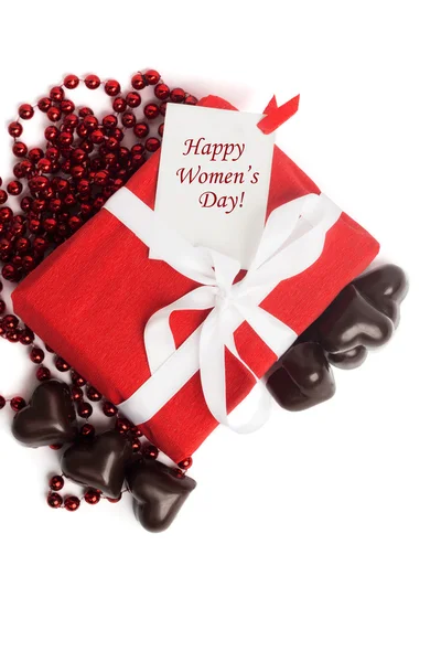 Tag Happy Women's Day with red present box with white ribbon — Stock Photo, Image