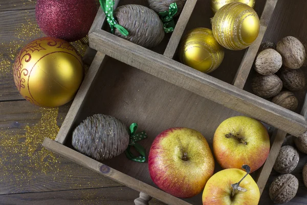 Christmas decorations on an old wooden board — Stock Photo, Image