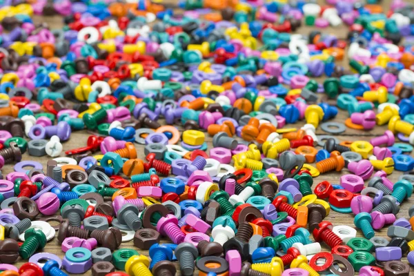 Mix of color nuts and bolts — Stock Photo, Image