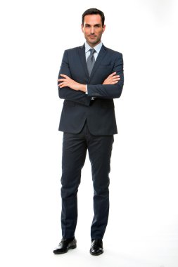 Full length portrait of a businessman looking at camera with crossed arms