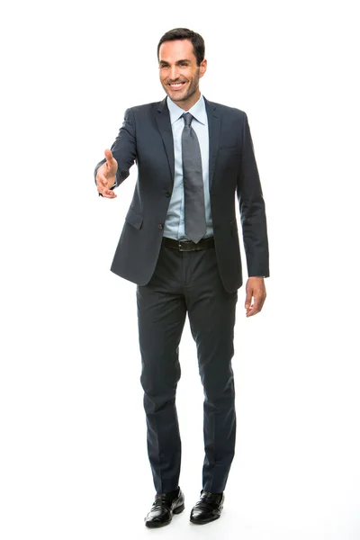 Full length portrait of a businessman smiling raising his arm for shaking hands — Stock Photo, Image