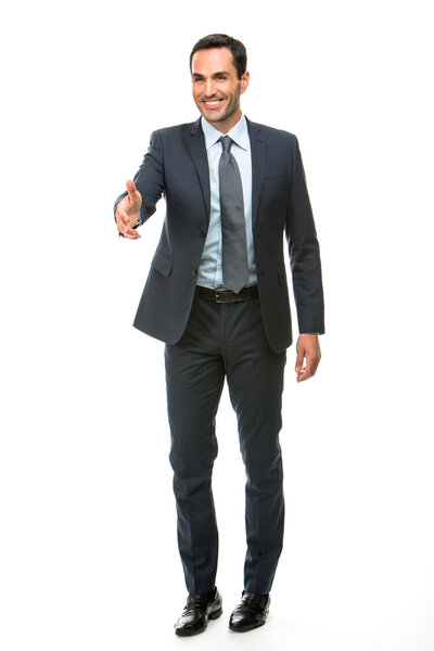 Full length portrait of a businessman smiling raising his arm for shaking hands