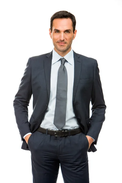 Half length portrait of a businessman with hands in his pockets — Stock Photo, Image