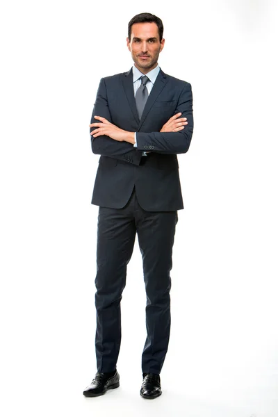 Full length portrait of a businessman looking at camera with crossed arms — Stock Photo, Image