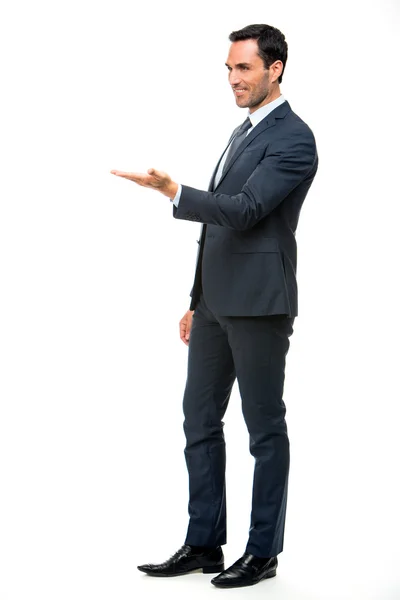 Full length  portrait of a smiling businessman in suit with lifted arm — Stock Photo, Image