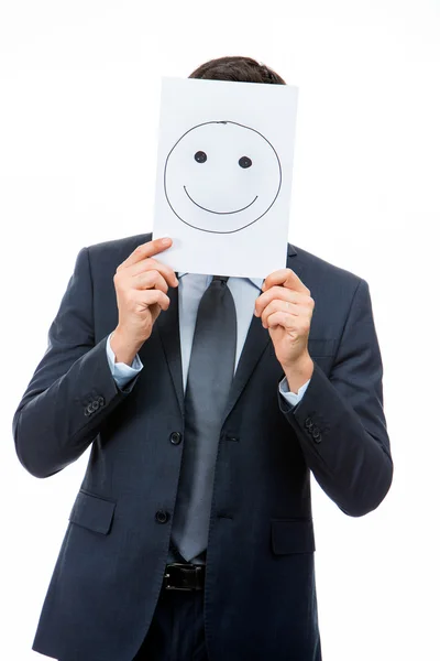 Half length portraif of a businessman holding white card with emoticon on it — Stock Photo, Image