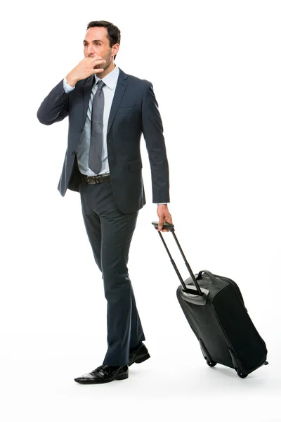 Full length portrait of a businessman with trolley stopping a taxi — Stock Photo, Image