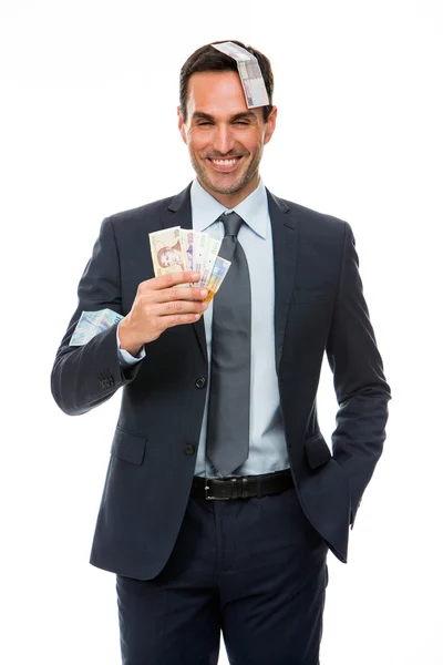 Half lenth portrait of a businessman smiling in falling money — Stock Photo, Image