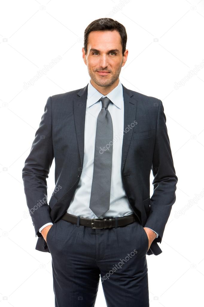 Half length portrait of a businessman with hands in his pockets