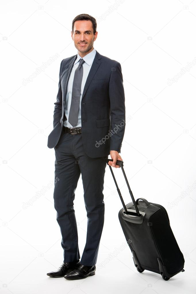 Full length portrait of a smiling businessman with trolley