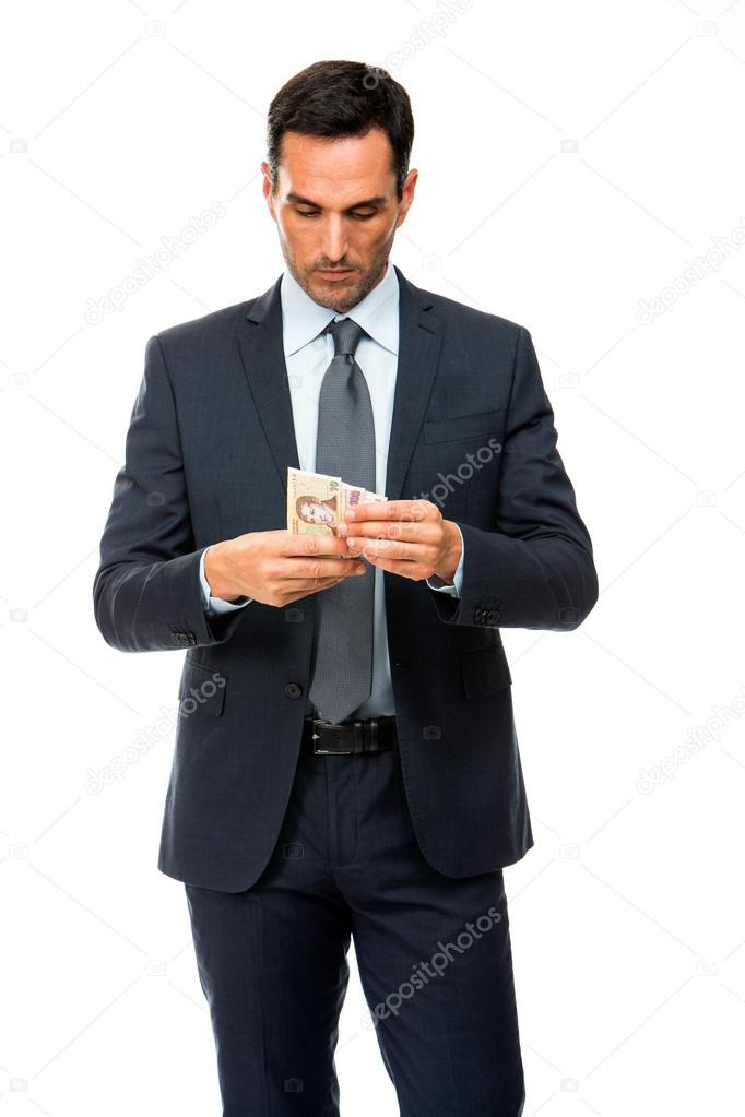 Half length portrait of a businessman counting money