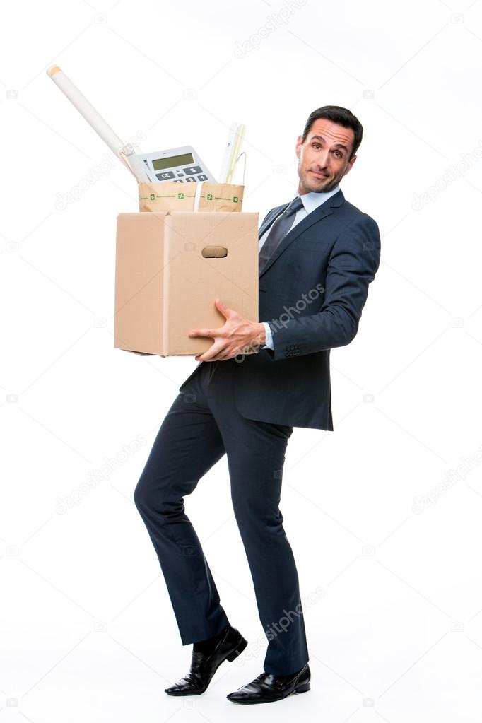 Full length portrait of a businessman carrying a cardboard box