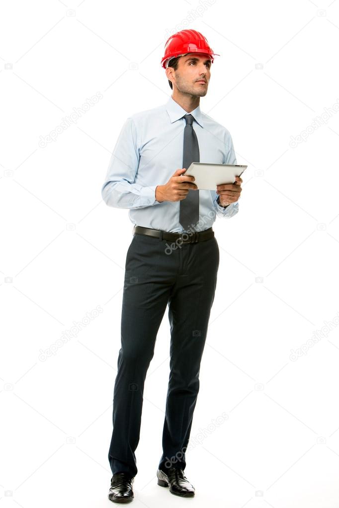 Full length portrait of a construction supervisor with digital tablet looking at a project
