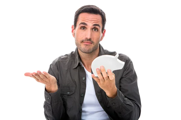 Retrato de un hombre mirando a la cámara y mostrando una alcancía — Foto de Stock