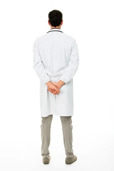 Visão traseira de comprimento total de um médico masculino com as mãos atrás das costas — Fotografia de Stock