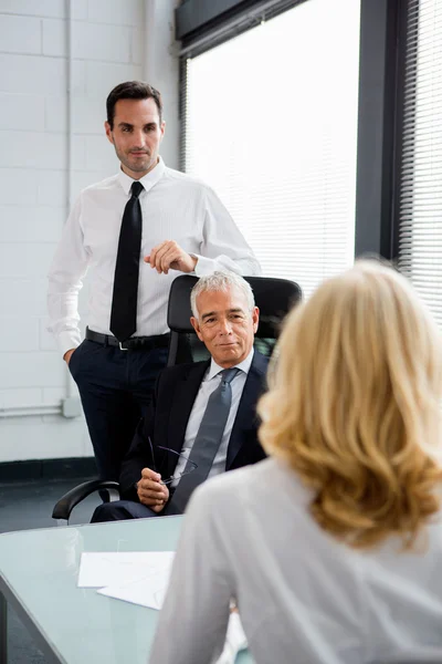 Three businesspeople having a meeting in the office — Stock Photo, Image