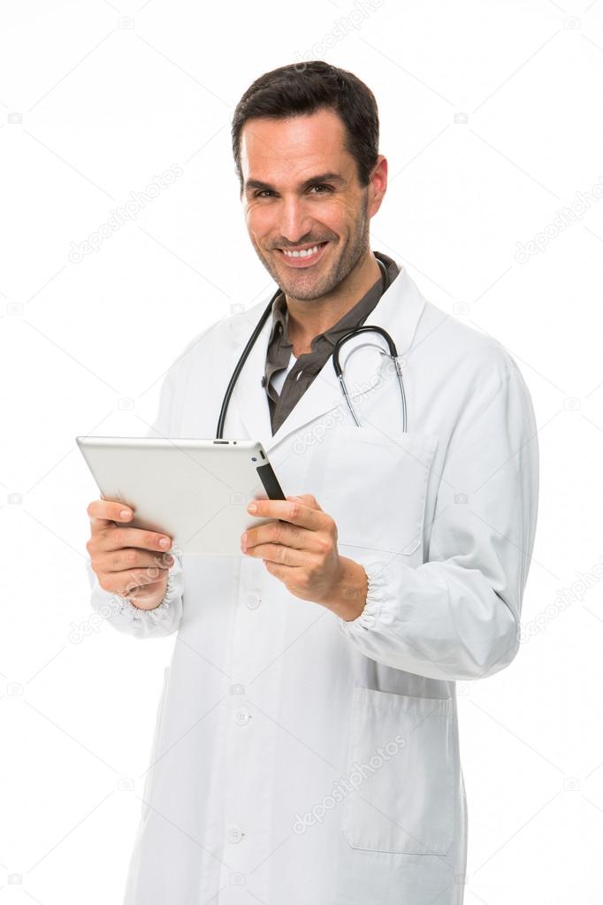 Half length portrait os a smiling male doctor with stethoscope and holding a digital tablet
