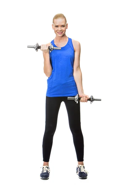 Blonde woman wearing fitness clothing exercising with weights — Stock Photo, Image