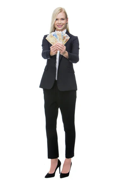 Businesswoman smiling and holding money — Stock Photo, Image